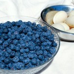 Bowl of blueberries, bowl of eggs