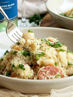 Creamy Cauliflower Risotto with White Wine, Scallops and Sausage | Naughty Nutrition