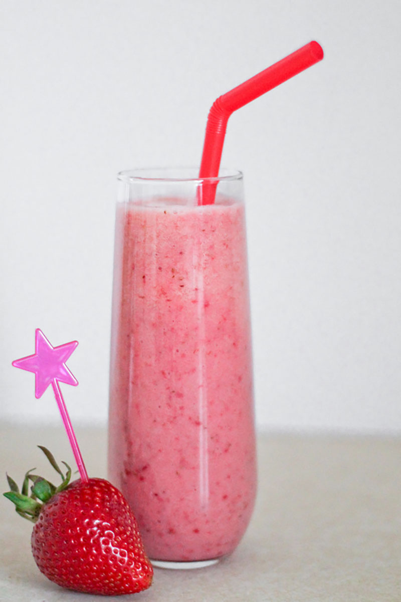 Pink Sunrise blossom smoothie in a tall glass