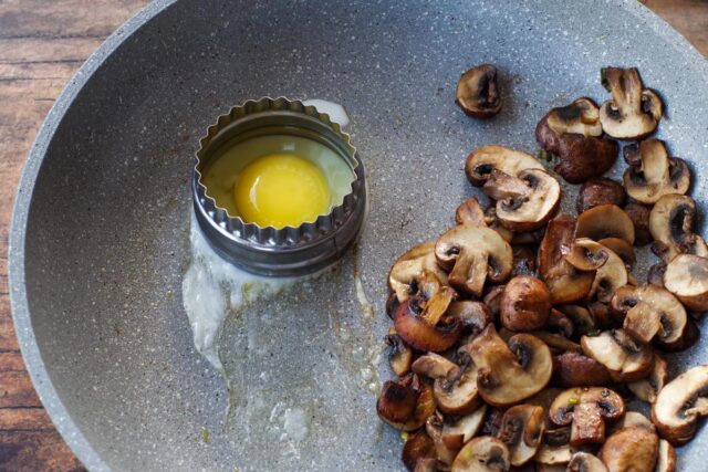 Mushrooms and egg on a pan