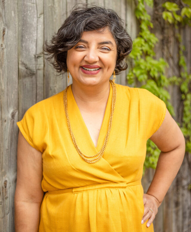 Puneeta Chhitwal-Varma a person in yellow dress standing.