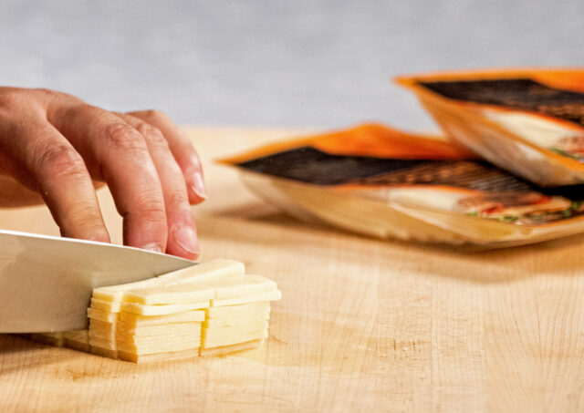 Cutting cheese.