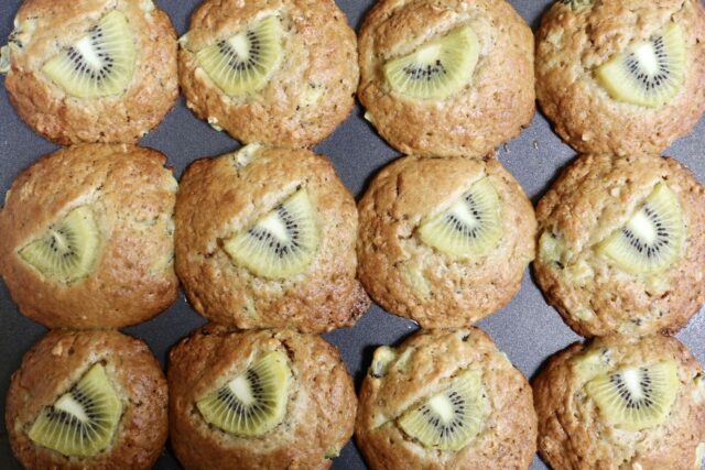 Kiwi muffins in a baking muffin pan.