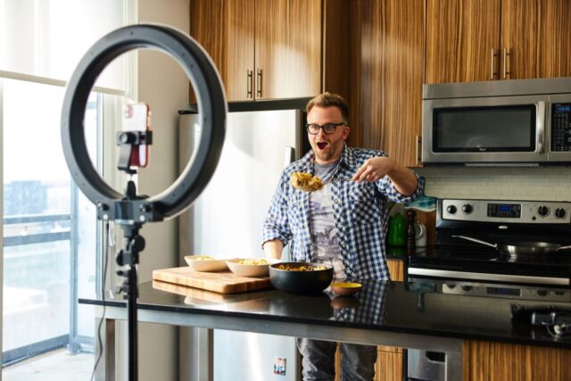 A person behind the kitchen island.